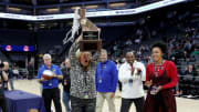 Harvard-Westlake coach Melissa Hearlihy holds up the CIF State D2 championship trophy after a 60-45 win over Colfax at Golden 1 Center.