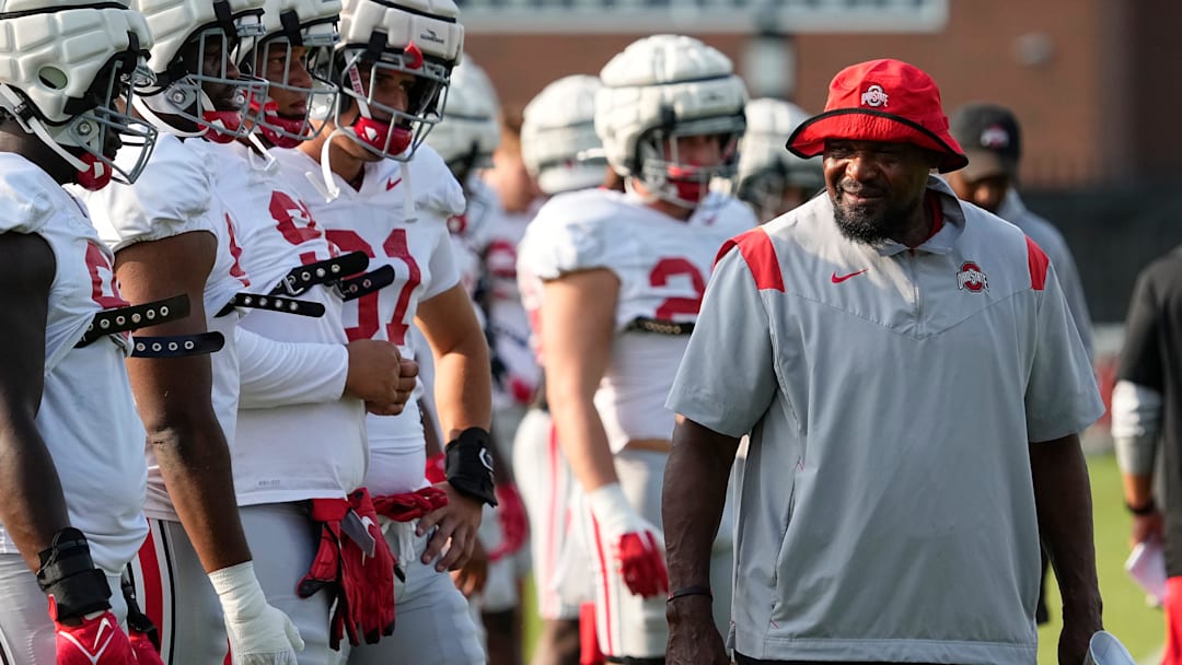 Aug 8, 2024; Columbus, Ohio, USA; Ohio State Buckeyes defensive line coach Larry Johnson talks to players during football practice at the Woody Hayes Athletic Complex.