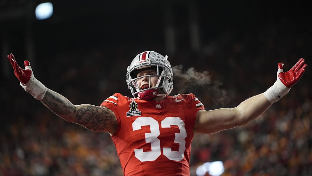 Ohio State Buckeyes defensive end Jack Sawyer (33) celebrates a sack of Tennessee Volunteers quarterback Nico Iamaleava (8) during the first half of the College Football Playoff first round game at Ohio Stadium in Columbus on Dec. 21, 2024.