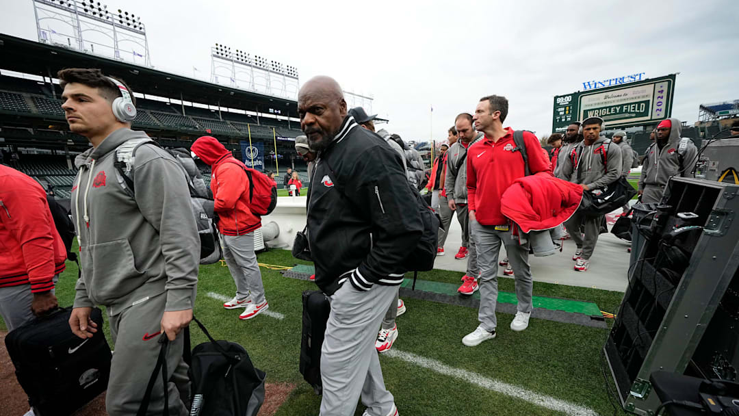 Ohio State Buckeyes defensive line coach Larry Johnson heads into the lockerroom behind the first base dugout prior to the NCAA football game between the Ohio State Buckeyes and the Northwestern Wildcats at Wrigley Field in Chicago on Saturday, Nov. 16, 2024.