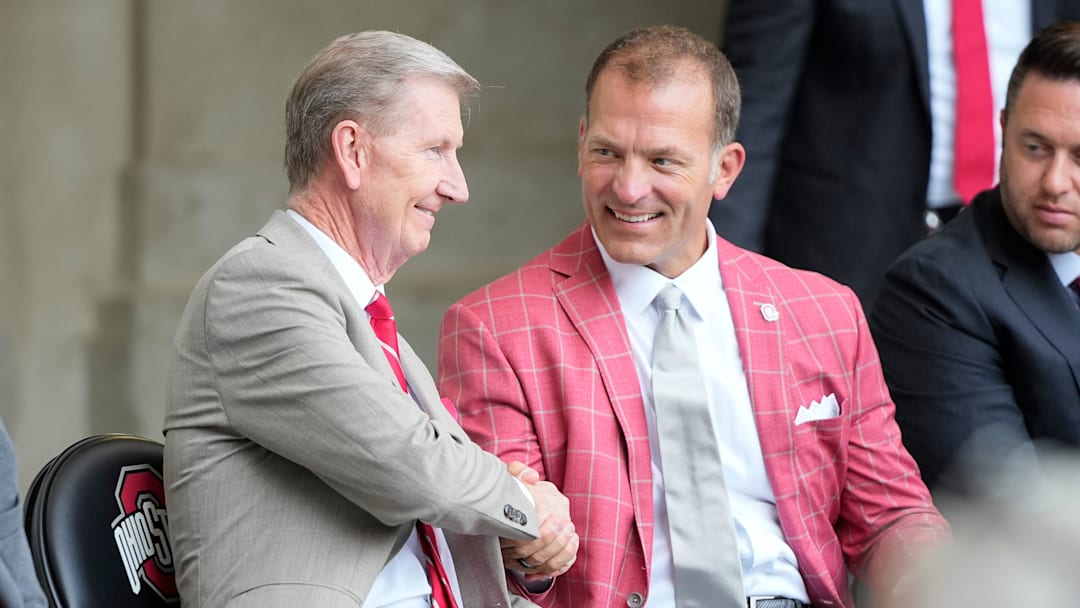 Aug 30, 2024; Columbus, OH, USA; Ohio State president Ted Carter and athletic director Ross Bjork attend the unveiling of a statue for former Buckeyes running back Archie Griffin outside Ohio Stadium.