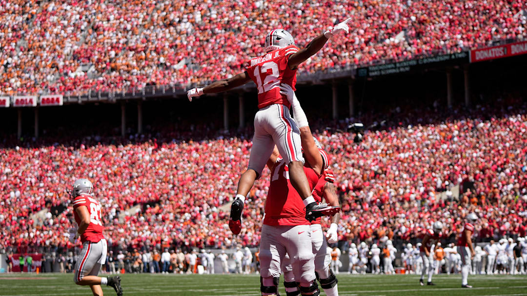 Ohio State Buckeyes running back CJ Donaldson (12) celebrates a touchdown with offensive lineman Carson Hinzman (75) during the first half of the NCAA football game against the Texas Longhorns at Ohio Stadium on Aug. 30, 2025.