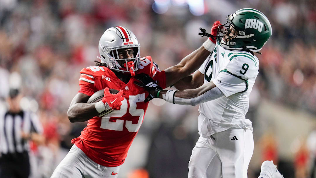 Ohio State Buckeyes running back Bo Jackson (25) stiff arms Ohio Bobcats cornerback Michael Mack II (9) during the second half of the NCAA football game at Ohio Stadium on Sept. 13, 2025. Ohio State won 37-9.
