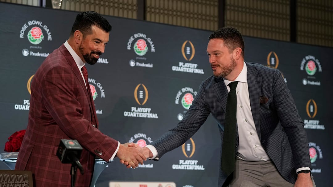 Ohio State Buckeyes head coach Ryan Day shakes hands with Oregon Ducks head coach Dan Lanning during a Rose Bowl press conference in Los Angeles on Dec. 31, 2024.
