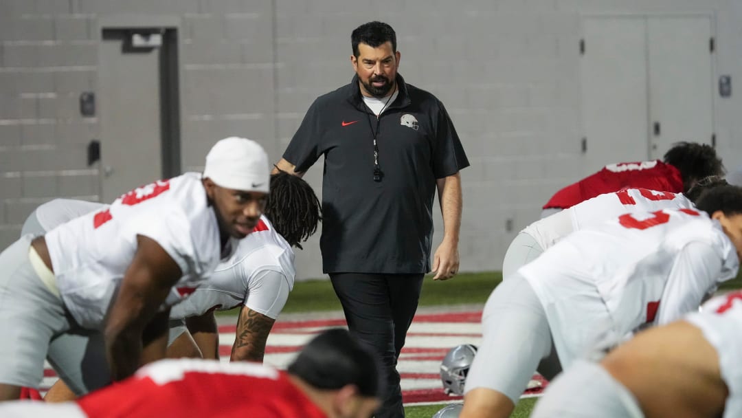 Mar 7, 2024; Columbus, OH, USA; Ohio State Buckeyes head coach Ryan Day watches players stretch during spring football practice at the Woody Hayes Athletic Center.