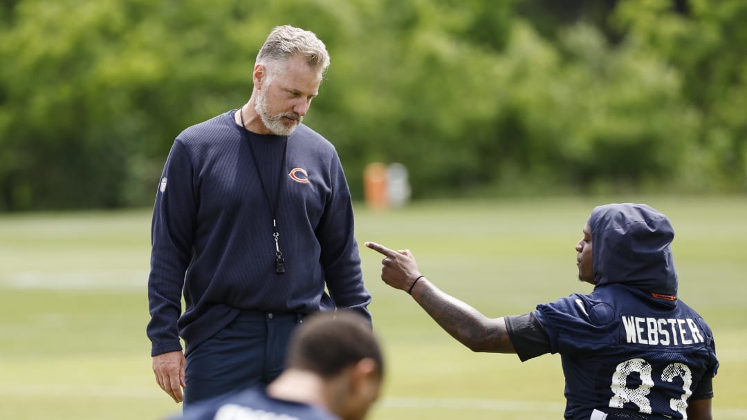 Jun 5, 2024; Lake Forest, IL, USA; Chicago Bears head coach Matt Eberflus talks with Chicago Bears wide receiver Nsimba Webster (83) during the team's minicamp at Halas Hall. Mandatory Credit: Kamil Krzaczynski-USA TODAY Sports