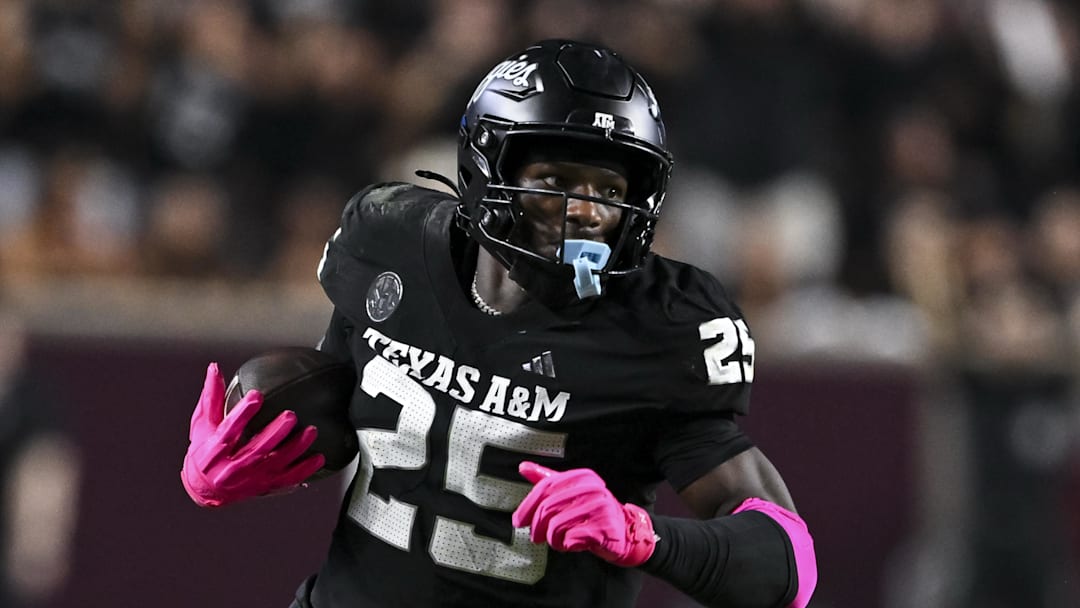 Oct 4, 2025; College Station, Texas, USA; Texas A&M Aggies defensive tackle DJ Hicks (5) runs the ball after a strip sack during the fourth quarter against the Mississippi State Bulldogs at Kyle Field. Mandatory Credit: Maria Lysaker-Imagn Images 