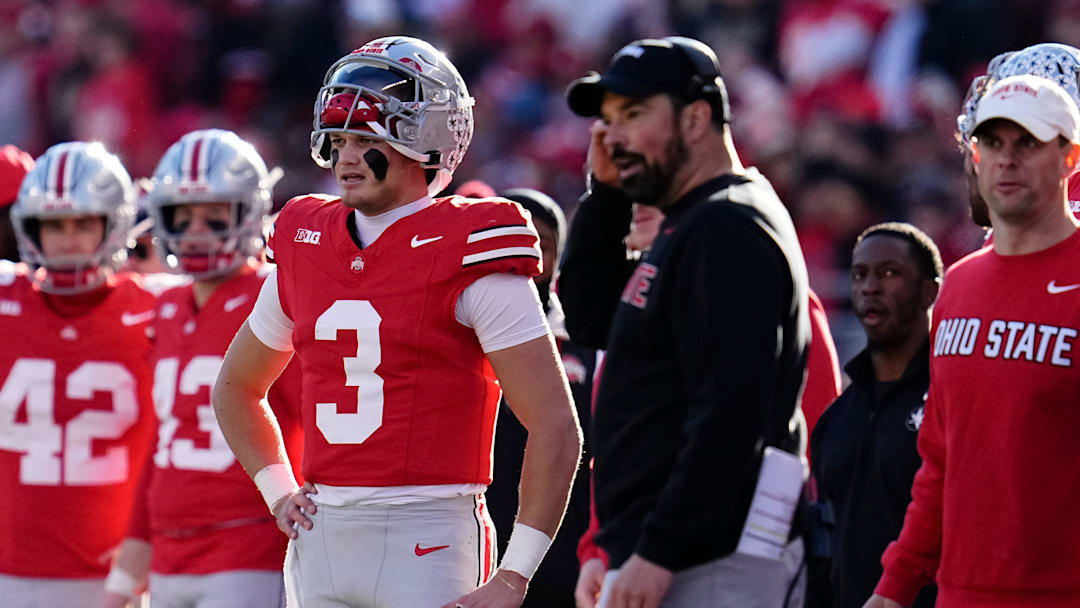 Ohio State Buckeyes quarterback Lincoln Kienholz (3) and head coach Ryan Day watch during the second half of the NCAA football game against the Rutgers Scarlet Knights at Ohio Stadium in Columbus on Nov. 22, 2025. Ohio State won 42-9.