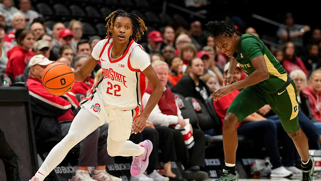 Ohio State Buckeyes guard Jaloni Cambridge (22) dribbles past Charlotte 49ers guard Alexis Andrews (4) during the first half of the NCAA women's basketball game at Value City Arena on Tuesday, Nov. 12, 2024.
