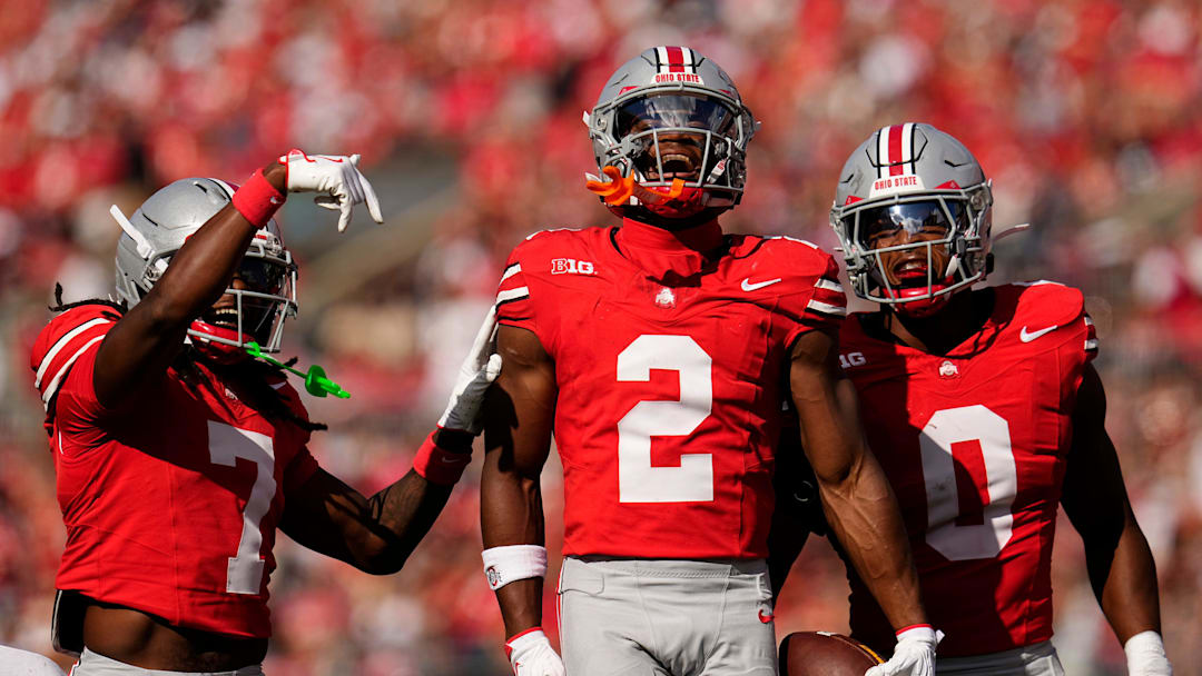 Ohio State Buckeyes safety Caleb Downs (2) celebrates an interception with cornerback Jermaine Mathews Jr. (7) abnd linebacker Sonny Styles (0) during the first half of the NCAA football game against the Grambling State Tigers at Ohio Stadium on Sept. 6, 2025.