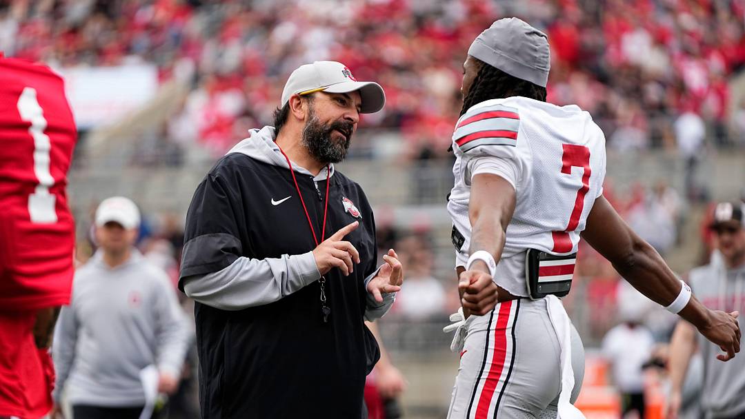 Ohio State Buckeyes defensive coordinator Matt Patricia talk to cornerback Jermaine Mathews Jr. (7) during the Ohio State football spring game at Ohio Stadium in Columbus on April 18, 2026.