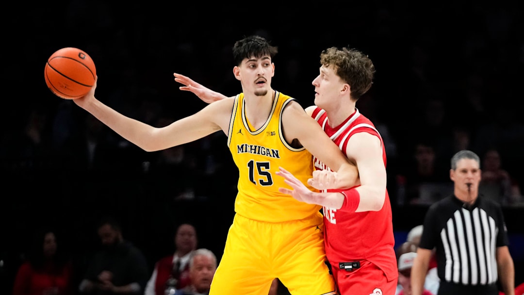 Ohio State Buckeyes center Christoph Tilly (13) defends Michigan Wolverines center Aday Mara (15) during the first half of the NCAA men's basketball game at the Schottenstein Center in Columbus on Feb. 8, 2026.