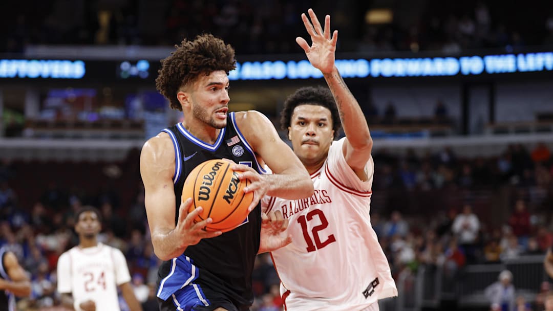 Duke’s Cameron Boozer drives to the basket against Arkansas forward Malique Ewin on Thanksgiving. Duke’s Cameron Boozer drives to the basket against Arkansas forward Malique Ewin on Thanksgiving.