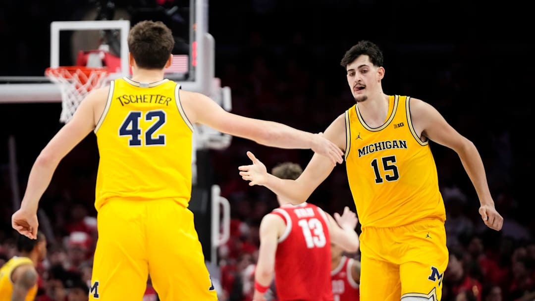 Michigan Wolverines center Aday Mara (15) celebrates a shot with forward Will Tschetter (42) during the second half of the NCAA men's basketball game against the Ohio State Buckeyes at the Schottenstein Center in Columbus on Feb. 8, 2026. Ohio State lost 82-61.