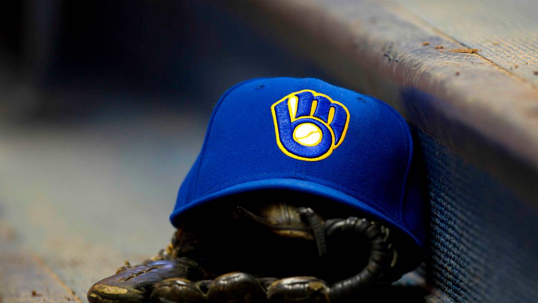 June 10, 2011; Milwaukee, WI, USA;   A Milwaukee Brewers hat and glove during the game against the St. Louis Cardinals at Miller Park.  The Brewers defeated the Cardinals 8-0. Mandatory Credit: Jeff Hanisch-USA TODAY Sports