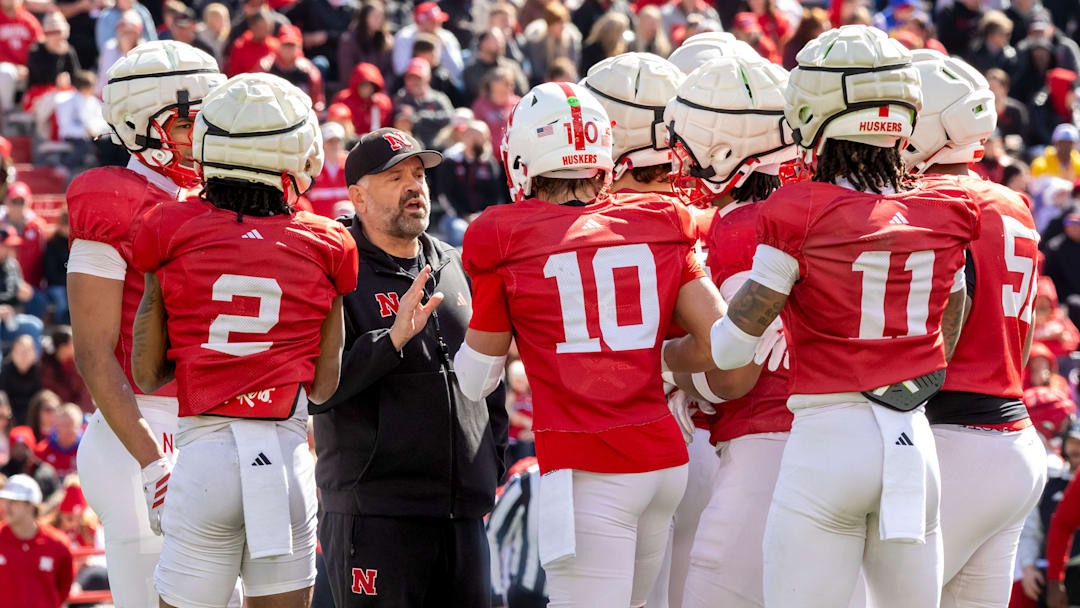 Nebraska football coach Matt Rhule huddles with the offense during the 2026 Red-White Spring Game.