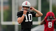 Ohio State Buckeyes quarterback Julian Sayin (10) buckles his helmet during the first football practice of the season at the Woody Hayes Athletic Center on July 31, 2025.