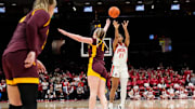 Ohio State Buckeyes guard Chance Gray (21) shoots over Minnesota Golden Gophers forward Mallory Heyer (24) during overtime of the NCAA women's basketball game at Value City Arena in Columbus on Feb. 13, 2025. Ohio State won 87-84.