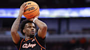 Nov 27, 2025; Chicago, Illinois, USA; Oklahoma State Cowboys guard Jaylen Curry (0) shoots a free throw against Northwestern Wildcats during the first half at United Center. Mandatory Credit: Kamil Krzaczynski-Imagn Images