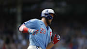 Jul 4, 2025; Chicago, Illinois, USA; Chicago Cubs first baseman Michael Busch (29) rounds the bases after hitting a solo home run against the St. Louis Cardinals during the seventh inning at Wrigley Field. 