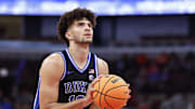 Nov 27, 2025; Chicago, Illinois, USA; Duke Blue Devils forward Cameron Boozer (12) shoots a free throw against the Arkansas Razorbacks during the second half at United Center. Mandatory Credit: Kamil Krzaczynski-Imagn Images