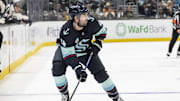 Jan 28, 2024; Seattle, Washington, USA; Seattle Kraken defenseman Justin Schultz (4) skates with the puck against the Columbus Blue Jackets at Climate Pledge Arena. Mandatory Credit: Stephen Brashear-Imagn Images