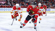 Jan 13, 2025; Chicago, Illinois, USA; Chicago Blackhawks left wing Taylor Hall (71) looks to pass the puck against the Calgary Flames during the first period at United Center. Mandatory Credit: Kamil Krzaczynski-Imagn Images