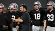 Mar 7, 2024; Columbus, OH, USA; Ohio State Buckeyes head coach Ryan Day talks to quarterbacks during