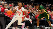 Ohio State Buckeyes guard Jaloni Cambridge (22) dribbles past Charlotte 49ers guard Alexis Andrews (4) during the first half of the NCAA women's basketball game at Value City Arena on Tuesday, Nov. 12, 2024.