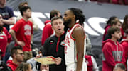 Feb 20, 2025; Columbus, Ohio, USA; Ohio State Buckeyes head coach Jake Diebler speaks to guard Evan Mahaffey (12) in the second half against the Northwestern Wildcats at Value City Arena. Mandatory Credit: Samantha Madar/USA Today Network via Imagn Images