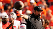 Ohio State Buckeyes head coach Ryan Day motions during warm ups prior to the NCAA football game against the Illinois Fighting Illini at Gies Memorial Stadium in Champaign on Oct. 11, 2025.