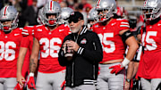 Ohio State Buckeyes defensive coordinator Jim Knowles leads warm ups prior to the NCAA football game against the Nebraska Cornhuskers at Ohio Stadium in Columbus on Saturday, Oct. 26, 2024.