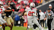Ohio State Buckeyes running back Bo Jackson (25) runs past Purdue Boilermakers defensive back Myles Slusher (9) during the NCAA football game at Ross-Ade Stadium in West Lafayette, Ind. on Nov. 8, 2025. Ohio State won 34-10.