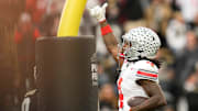 Ohio State Buckeyes wide receiver Jeremiah Smith (4) celebrates a touchdown during the NCAA football game at Ross-Ade Stadium in West Lafayette, Ind. on Nov. 8, 2025. Ohio State won 34-10.
