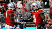 Ohio State Buckeyes wide receiver Carnell Tate (17) celebrates a touchdown by wide receiver Jeremiah Smith (4) during the first half of the NCAA football game against the Minnesota Golden Gophers at Ohio Stadium in Columbus on Oct. 4, 2025.