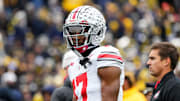 Ohio State Buckeyes wide receiver Carnell Tate (17) warms up prior to the NCAA football game against the Michigan Wolverines at Michigan Stadium in Ann Arbor, Mich. on Nov. 29, 2025.