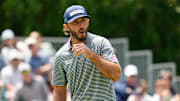 Max Homa reacts to a missed birdie putt on the eighth green.