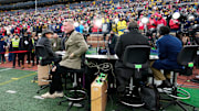 The ESPN College GameDay crew broadcast from the field at Michigan Stadium during the NCAA football game between the Michigan Wolverines and the Ohio State Buckeyes in Ann Arbor, Mich. on Nov. 29, 2025. Ohio State won 27-9.