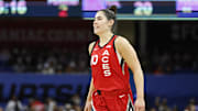 Aug 25, 2024; Chicago, Illinois, USA; Las Vegas Aces guard Kelsey Plum (10) smiles during the first half of a basketball game against the Chicago Sky at Wintrust Arena. Mandatory Credit: Kamil Krzaczynski-Imagn Images