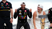 NASCAR Cup Series driver Bubba Wallace (23) celebrates on the yard of bricks Sunday, July 27, 2025, during the Brickyard 400 at Indianapolis Motor Speedway.