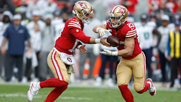 San Francisco 49ers quarterback Brock Purdy (L) and running back Christian McCaffrey (R)