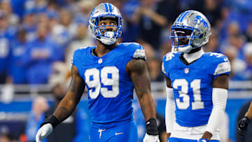 Za'Darius Smith (99) and Kerby Joseph (31)