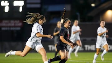 Sep 26, 2024; Columbus, Ohio, USA; Ohio State Buckeyes midfielder Amanda Schlueter (2) dribbles around Michigan State Spartans forward Meg Hughes (9) during the NCAA women's soccer game at Jesse Owens Memorial Stadium.