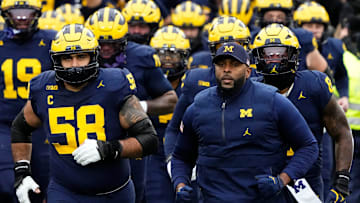 Michigan Wolverines head coach Sherrone Moore leads his team onto the field prior to the NCAA football game against the Ohio State Buckeyes at Michigan Stadium in Ann Arbor, Mich. on Nov. 29, 2025.