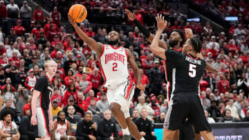 Mar 26, 2024; Columbus, OH, USA; Ohio State Buckeyes guard Bruce Thornton (2) drives to the basket past Georgia Bulldogs center Frank Anselem-Ibe (5) during the second half of the NIT quarterfinals at Value City Arena. Ohio State lost 79-77.