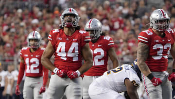 Sep 17, 2022; Columbus, Ohio, USA; Ohio State Buckeyes defensive end J.T. Tuimoloau (44) celebrates a tackle during the first half of the NCAA Division I football game against the Toledo Rockets at Ohio Stadium. Mandatory Credit: Adam Cairns-The Columbus Dispatch

Ncaa Football Toledo Rockets At Ohio State Buckeyes