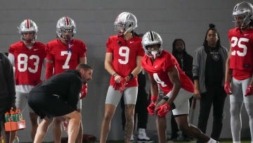 Mar 5, 2024; Columbus, OH, USA; Ohio State Buckeyes offensive coordinator Brian Hartline lines up beside wide receiver Jeremiah Smith (4) during the first spring practice at the Woody Hayes Athletic Center.