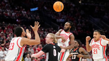 Mar 26, 2024; Columbus, OH, USA; Ohio State Buckeyes guard Bruce Thornton (2) passes over Georgia Bulldogs guard Blue Cain (0) to forward Zed Key (23) during the second half of the NIT quarterfinals at Value City Arena. Ohio State lost 79-77.