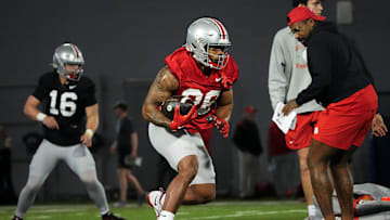 Mar 7, 2024; Columbus, OH, USA; Ohio State Buckeyes running back TC Caffey (28) runs during spring football practice at the Woody Hayes Athletic Center.