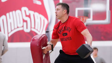 Jul 9, 2024; Columbus, OH, USA; Ohio State Buckeyes head coach Jake Diebler uses pads to play defense during a summer workout in the practice gym at the Schottenstein Center.